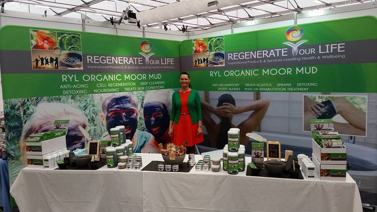 Regenerate Your Life Organic Moor Mud trade show booth display, promoting detox and healing.