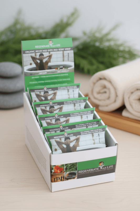 A display box of therapeutic Moor Mud Bath and Body Wrap product sachets.